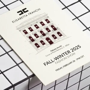 Elisabetta Franchi runway invitation card on a white tiles background