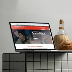 Laptop mockup showing a website screen with Mario & Luigi restaurant homepage